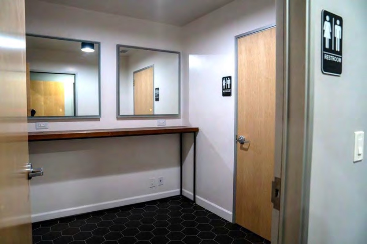 Private dressing room with mirrors and a counter
