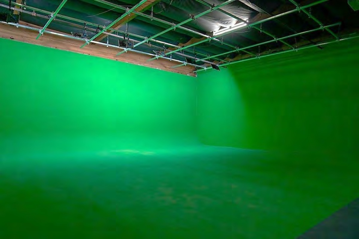 The insert stage's pre-lit green cyc wall