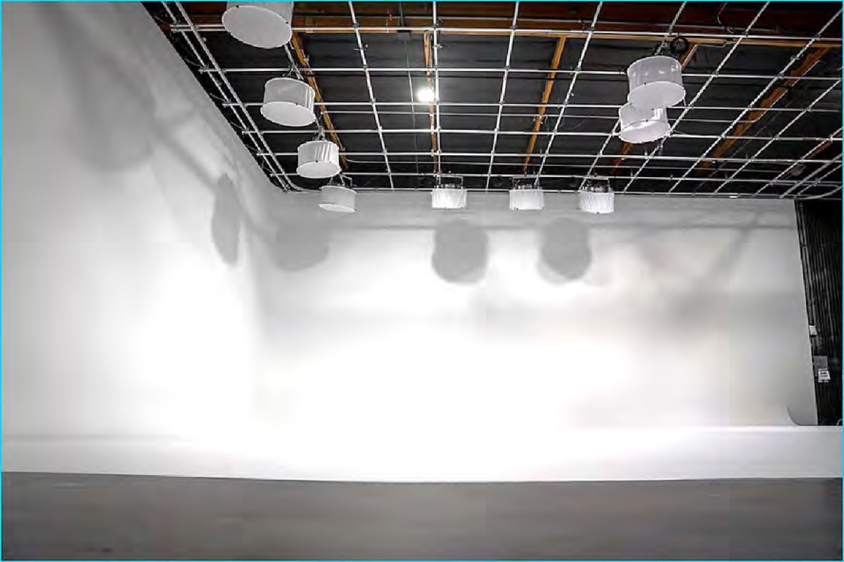 Stage 1's white two-wall cyc under the lighting grid